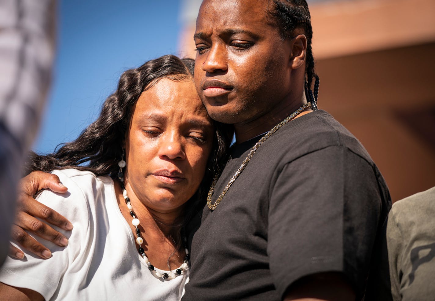 Tijuana Wilson, the mother of Winston Smith, is held by Jesse Floyd, Smith's brother, during a press conference outside the Minnesota Bureau of Criminal Apprehension. ] LEILA NAVIDI • leila.navidi@startribune.com