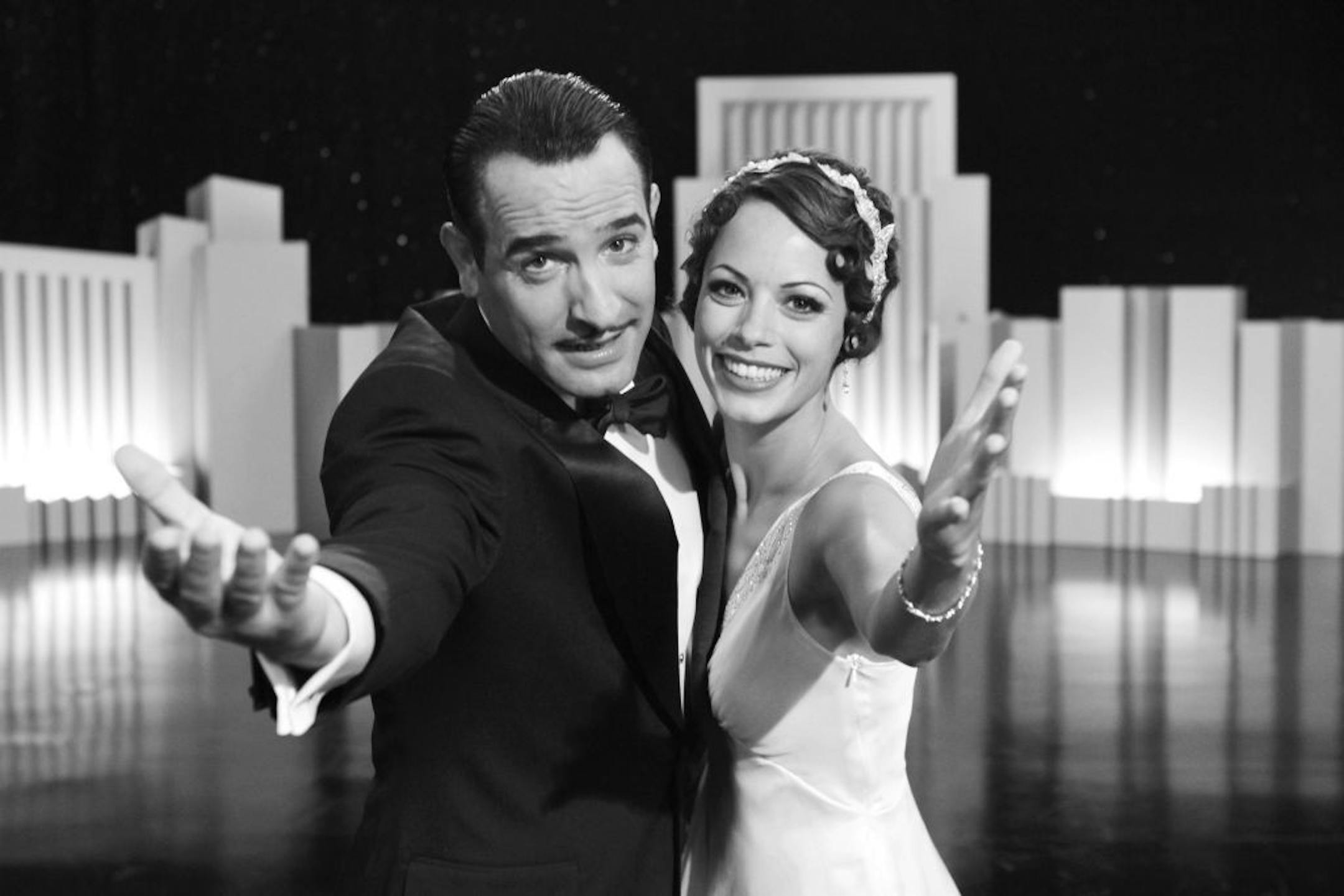 Jean Dujardin portrays George Valentin, left, and Berenice Bejo portrays Peppy Miller in a scene from "The Artist."
