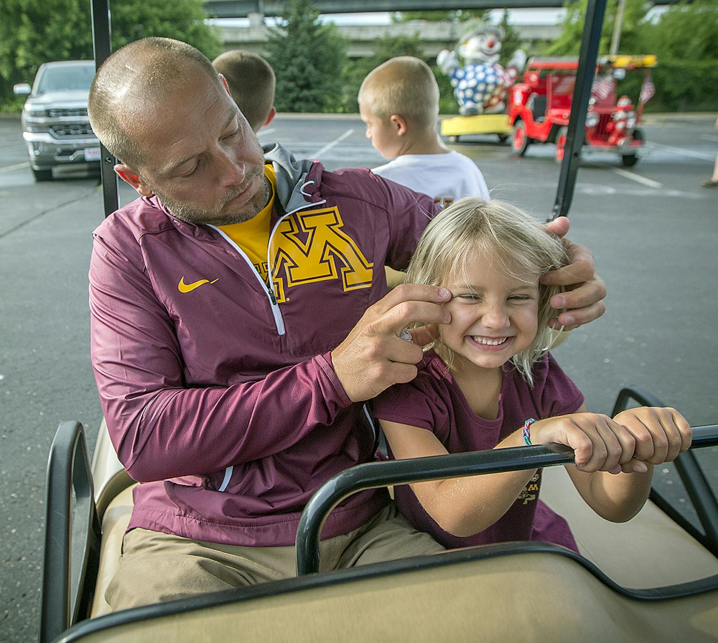 PJ Fleck waited with his kids including Paisley, 4, to lead the CenterPoint Energy Torchlight Parade as grand marshal, July 19, 2017 in Minneapolis, MN. ] ELIZABETH FLORES &#xef; liz.flores@startribune.com