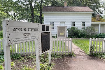 The front entrance to the John H. Stevens house in Minnehaha Park. The roof of the summer kitchen, at right, is covered in moss.