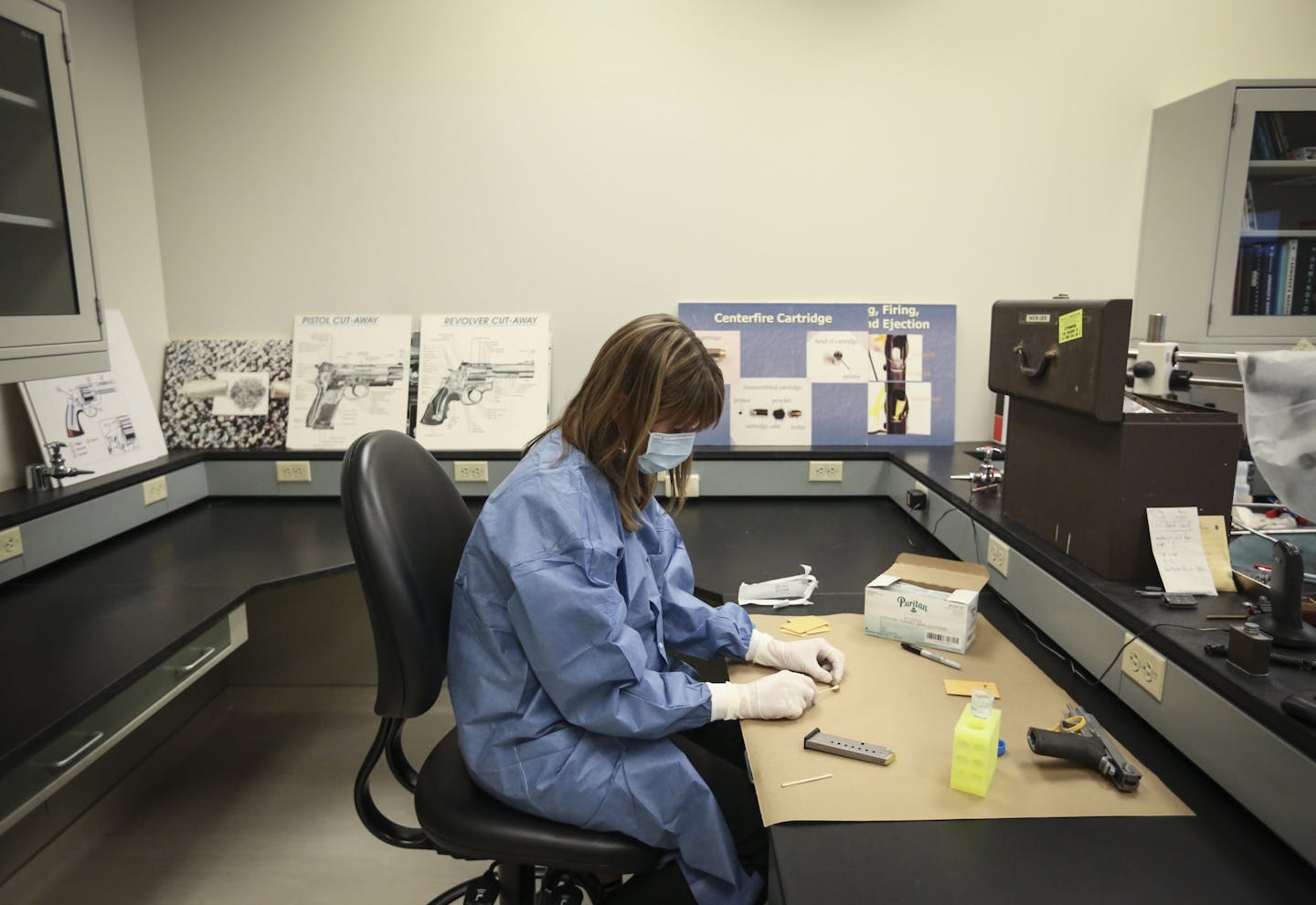 DNA supervisor Kristine Deters demonstrated how she collects DNA from firearms at the BCA in St. Paul, Minn. on Thursday, December 18, 2014. ] REN&#xc9;E JONES SCHNEIDER reneejones@startribune.com