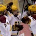 Gophers Hudson Fasting, left and Connor Reilly celebrated with Kyle Rau after scoring the overtime goal at the end of the game. ] (KYNDELL HARKNESS/ST