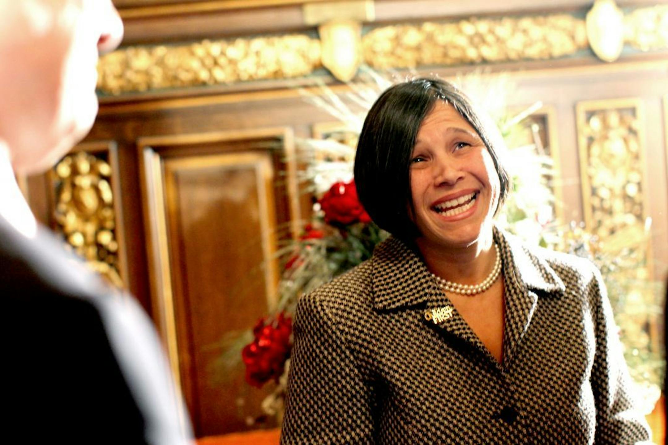 Minnesota Department of Education Commissioner Brenda Cassellius, right, greets people with Minnesota Governor Mark Dayton, at left, after a press conference announcing that Minnesota has won a federal Race to the Top Early Learning Challenge grant to advance early education efforts at the State Capitol in St. Paul December 16, 2011. �This is a great day for our state�s youngest learners and their families,� said Cassellius.