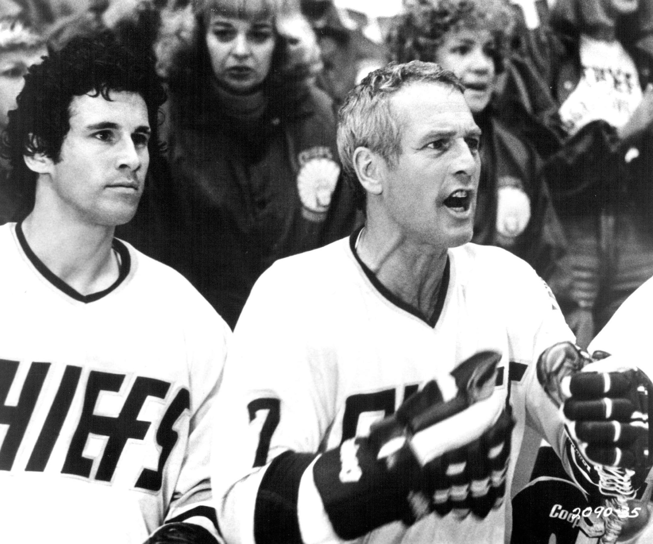 April 2, 1977 Slap Shot A tense moment for their usually inept hockey team is observed by Ned Braden (MICHAEL ONTKEAN) and Reggie Dunlop (PAUL NEWMAN) in this scene from "Slap Shot." "Slap Shot," an outrageous film about some preposterous characters in the sub-culture of professional ice hockey, stars Paul Newman, Michael Ontkean, Lindsay Crouse, Jennifer Warren, Jerry Houser and Strother Martin. Produced by Robert J. Wunsch and Stephan Friedman and directed by George Roy Hill from a screenplay