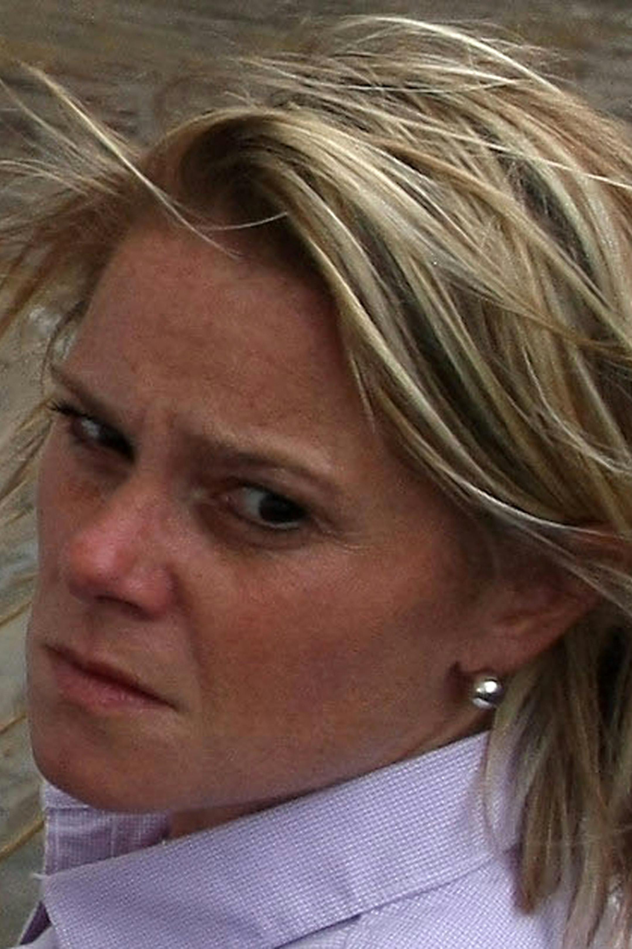 This Sept. 12, 2013 photo provided by the Office of the Governor of New Jersey shows Deputy Chief of Staff Bridget Anne Kelly during a tour with Gov. Chris Christie of the Seaside Heights, N.J. boardwalk, after it was hit by a massive fire. Christie fired Kelly Thursday, Jan. 9, 2014, and apologized over and over for his staff's "stupid" behavior, insisting during a nearly two-hour news conference that he had no idea anyone around him had engineered traffic jams as part of a political vendetta a