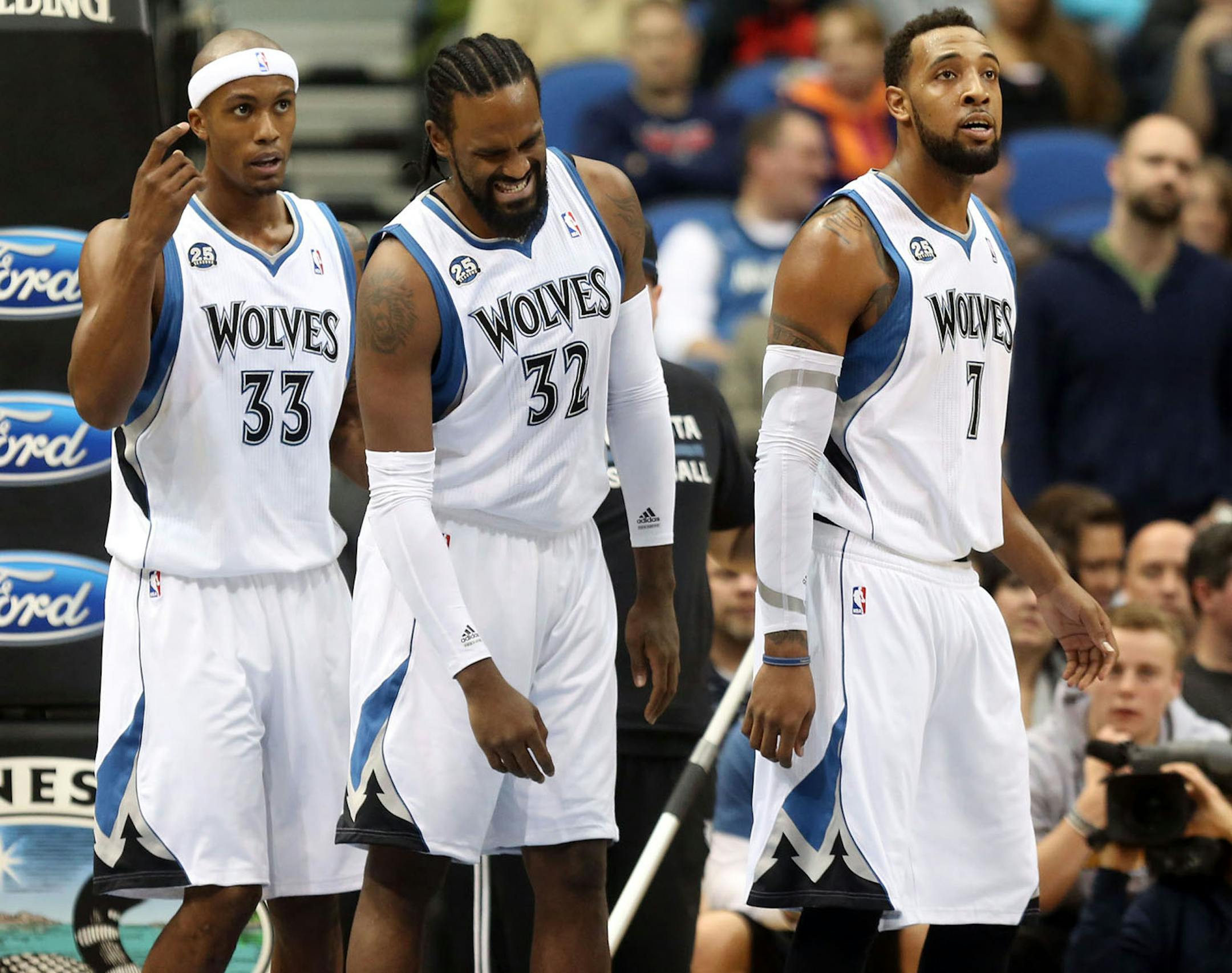 Wolves center Ronny Turiaf (middle, with teammates Dante Cunningham and Derrick Williams) walked off the floor with a fractured elbow from a fall during the first half at Target Center against Oklahoma City.