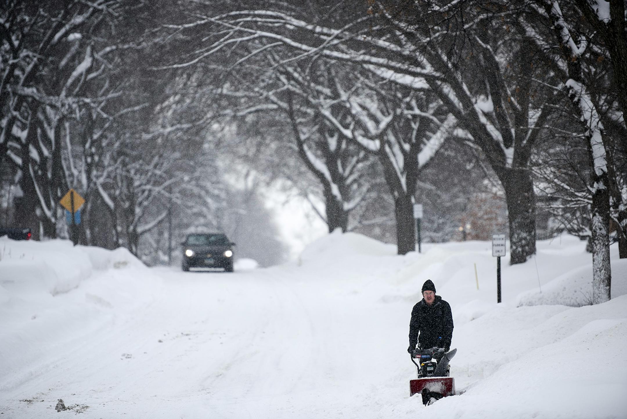 Joseph Poppy, of Robbinsdale, used a snowblower to remove snow from the front of his home at Lowery and France Avenue North. "I didn't go to work," said Poppy because of the snow, on Wednesday, Feb. 20, 2019 in Minneapolis.
