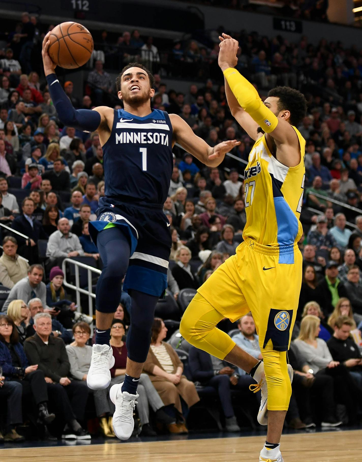 Minnesota Timberwolves guard Tyus Jones (1) scored a layup while being defended by Denver Nuggets guard Jamal Murray (27) in the second quarter. ] AARON LAVINSKY &#xef; aaron.lavinsky@startribune.com The Minnesota Timberwolves played the Denver Nuggets on Wednesday, Dec. 27, 2017 at Target Center in Minneapolis, Minn.