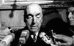 FILE - This Oct. 21, 1971 file photo shows Pablo Neruda, poet and then Chilean ambassador to France, talking with reporters in Paris after being named