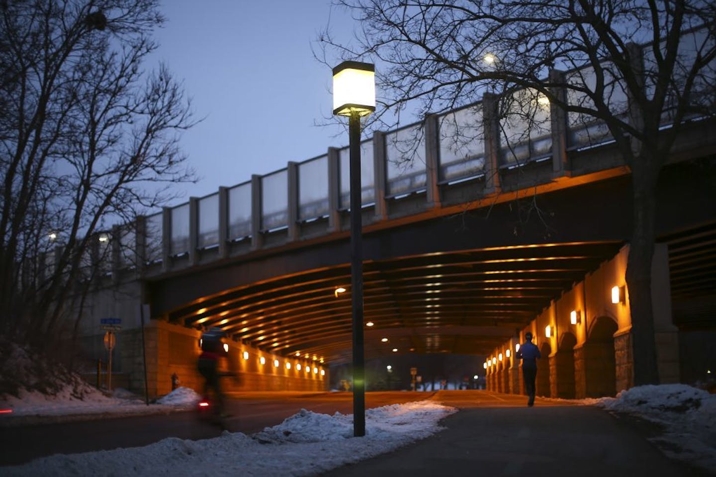 A jogger followed Minnehaha Parkway under the Interstate 35W overpass. Neighbors have raised concerns about plans about proposed changes to the parkway near Nicollet and also near 50th Street.