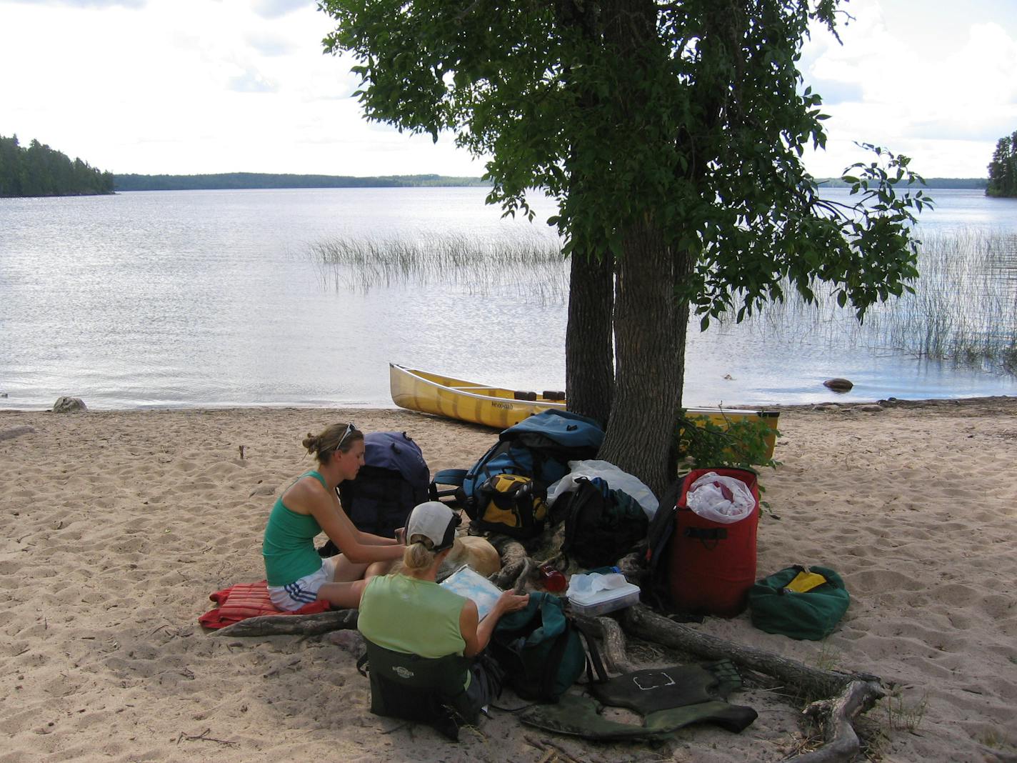 Canoers stop for lunch at a rare beach in Quetico. The spot, at the end of a portage, is a favorite swimming hole for many visitors.