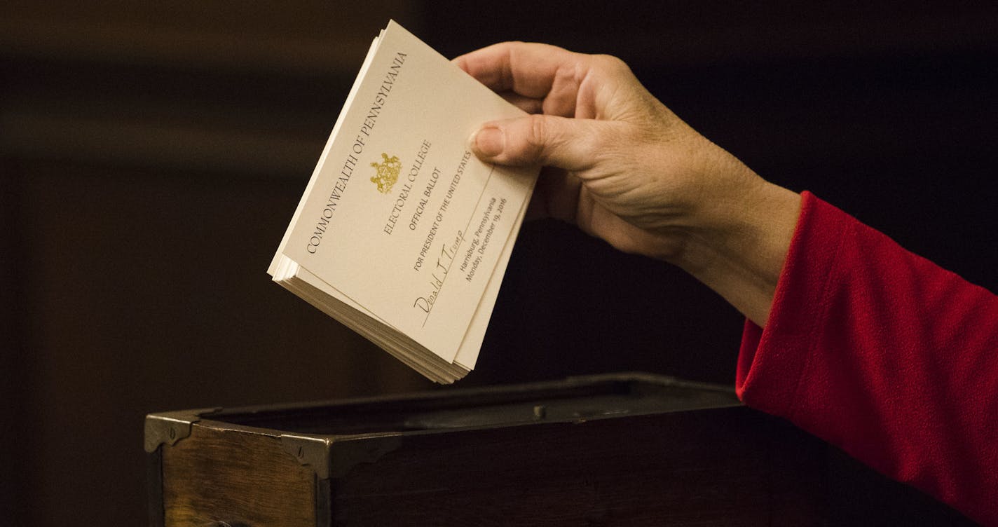 A teller places ballots into a box after tallying elector's votes during Pennsylvania's 58th Electoral College at the state Capitol in Harrisburg, Pa., Monday, Dec. 19, 2016. Members of Pennsylvania's 58th Electoral College met at the state Capitol amid demonstrations by hundreds of protesters to cast the state's 20 electoral votes for Trump. Trump beat Democrat Hillary Clinton in Pennsylvania by fewer than 45,000 votes out of more than 6 million cast, or by less than 1 percent. (AP Photo/Matt R