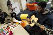 At the Teen Tech Center at the Minneapolis Central Library, James Myles played an orignal riff on the guitar. Myles enjoys various media such as photo