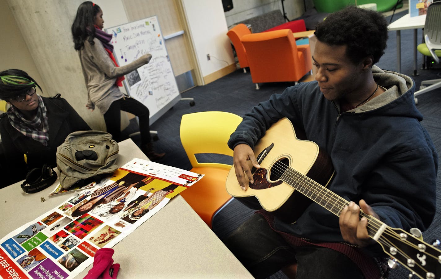 At the Teen Tech Center at the Minneapolis Central Library, James Myles played an orignal riff on the guitar. Myles enjoys various media such as photography and music.]richard tsong-taatarii/rtsong-taatarii@startribune.com