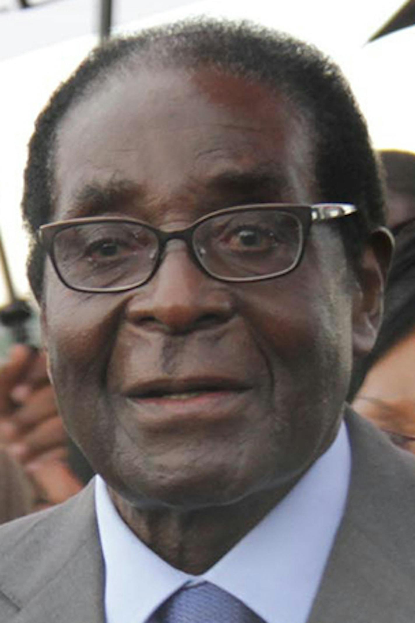 Zimbabwean president Robert Mugabe, in Harare, Thursday, April 12, 2012. President Robert Mugabe arrived home from Asia on Thursday morning as his party denied reports he had suffered a health emergency. (AP Photo) ORG XMIT: MIN2015073011255841