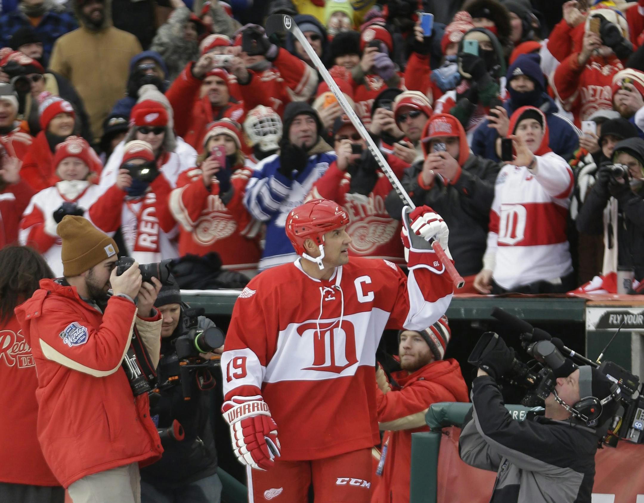 Detroit Red Wings forward Steve Yzerman is introduced before the Winter Classic alumni outdoor NHL hockey game at Comerica Park in Detroit, Tuesday, Dec. 31, 2013. (AP Photo/Carlos Osorio)