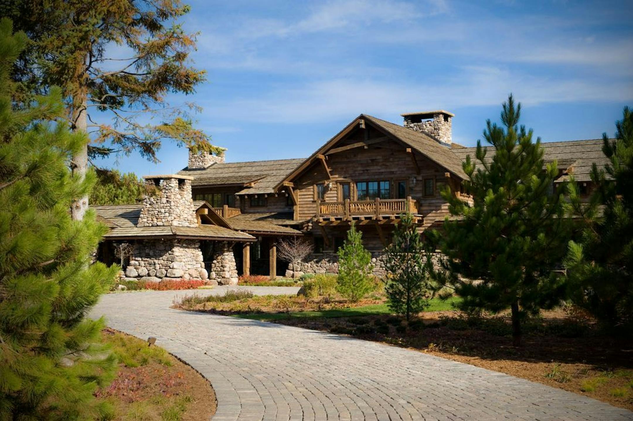 The home's architecture evokes luxurious mountain-style homes out west.