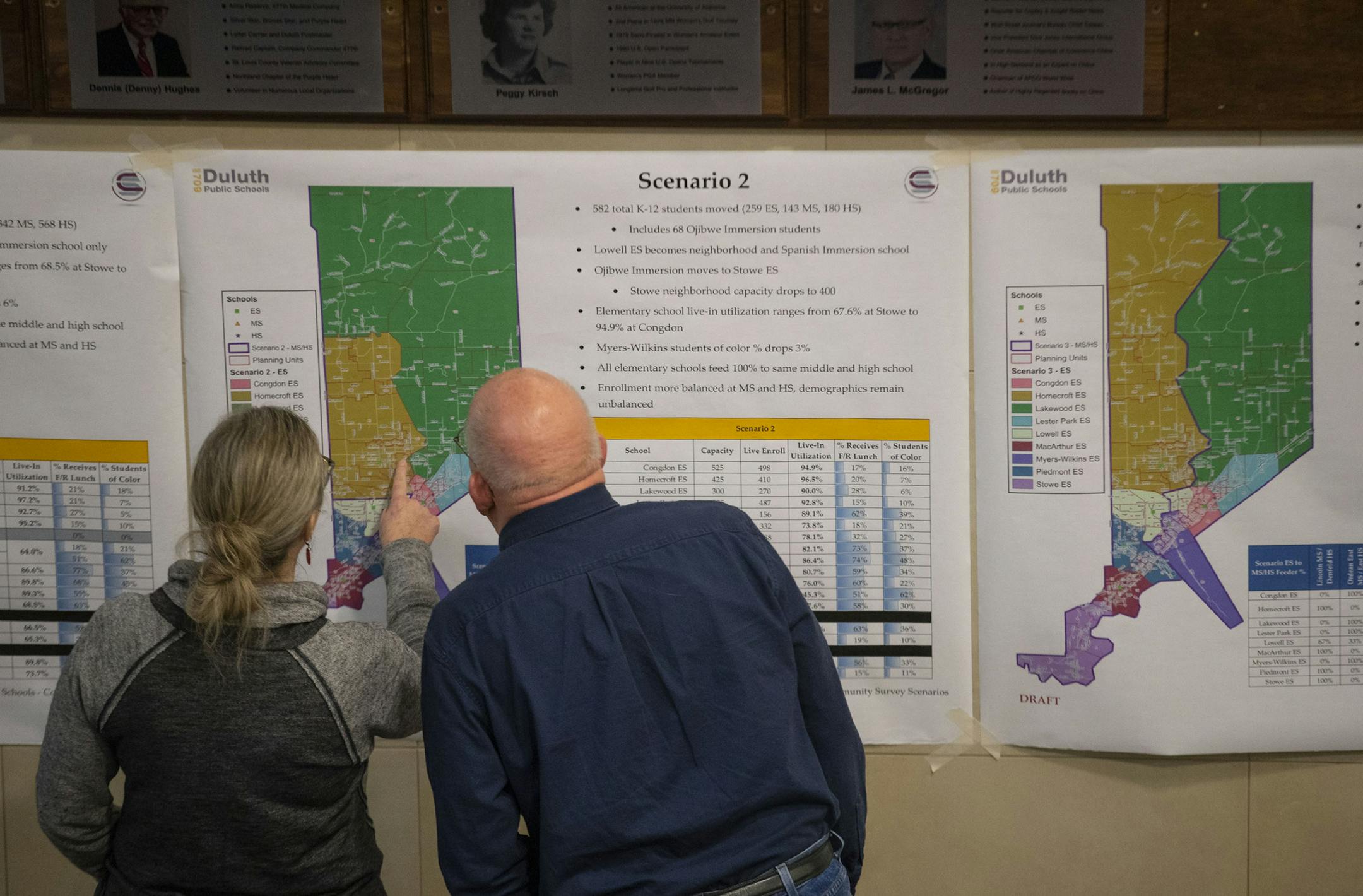 Two people discussed one of the scenarios posted on the wall before the meeting at East High School on Wednesday. ]
ALEX KORMANN &#x2022; alex.kormann@startribune.com An estimated 400-500 parents showed up at East High School on Wednesday January 22, 2020 to listen to a presentation on proposed changes for school boundaries, ask questions and provide feedback. The changes would potentially force students to switch the schools they attend. The meeting went south, however, as frustrated parents fe