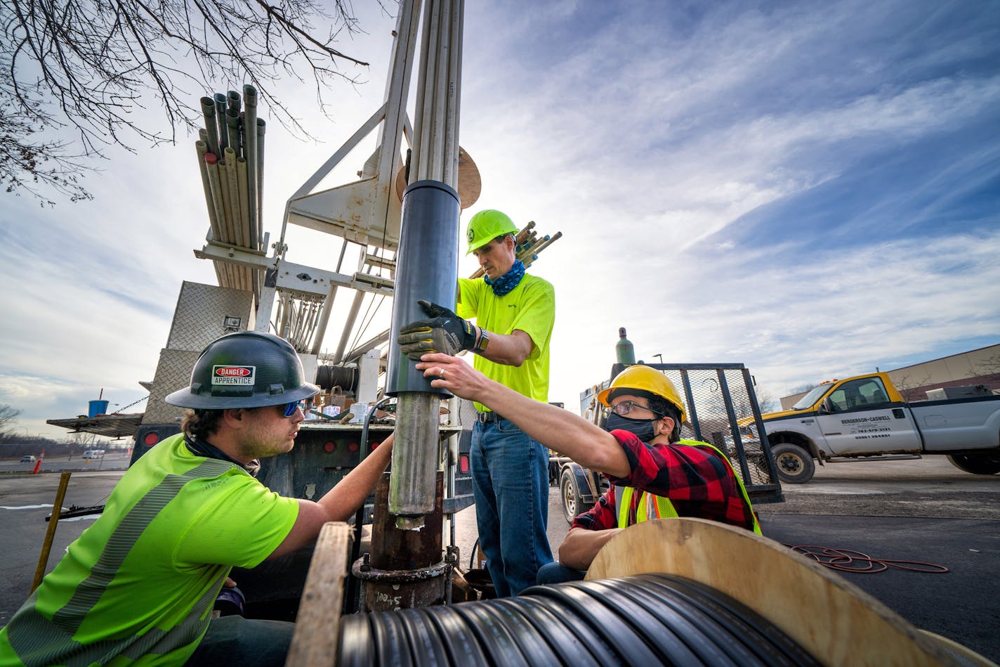 Founder of Darcy Solutions Jimmy Randolph, right, oversaw the installation of one of the four heat transfer cores at a geothermal installation at Steamfitters Pipefitters Local 455, St Paul. Cores are lowered 300 feet where the ground temperature is a consistent temperature of 50 degrees. Estimates are that the project will save the Local at least eighty percent in electrical costs for air conditioning. On the left is Chase Stauber and center David Henrich of Bergerson Caswell Wells and Pumps. C