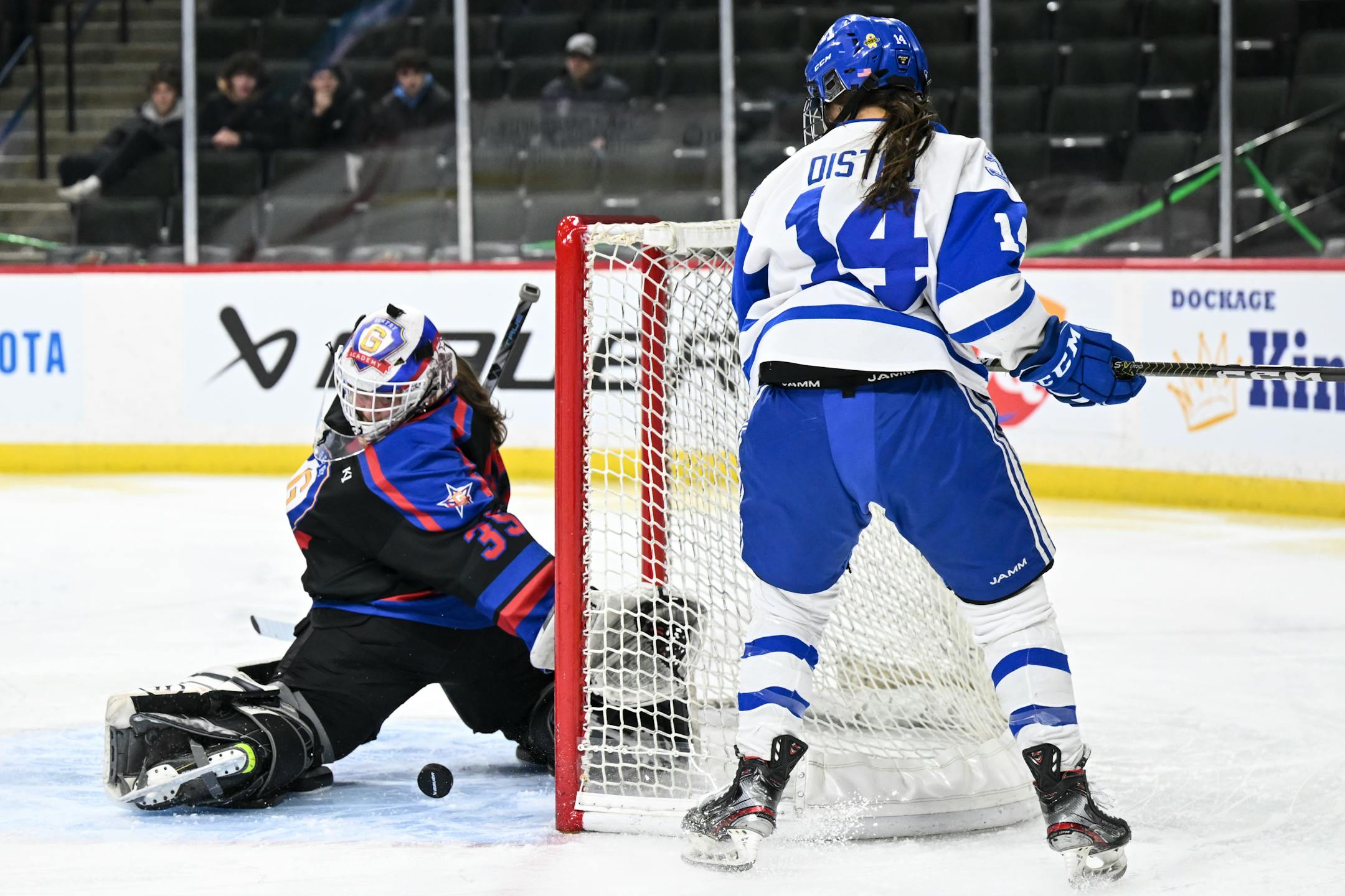 Gentry goaltender Zoe Laming (35) looks for the puck as Minnetonka forward Kendra Distad (14) looks for the rebound during the first period.