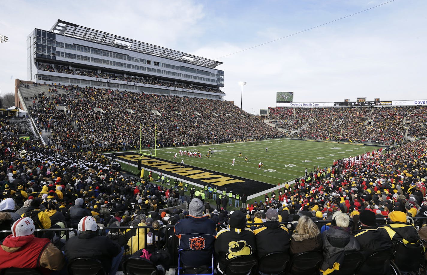 Iowa Hawkeye football fans flock to Kinnick Stadium.