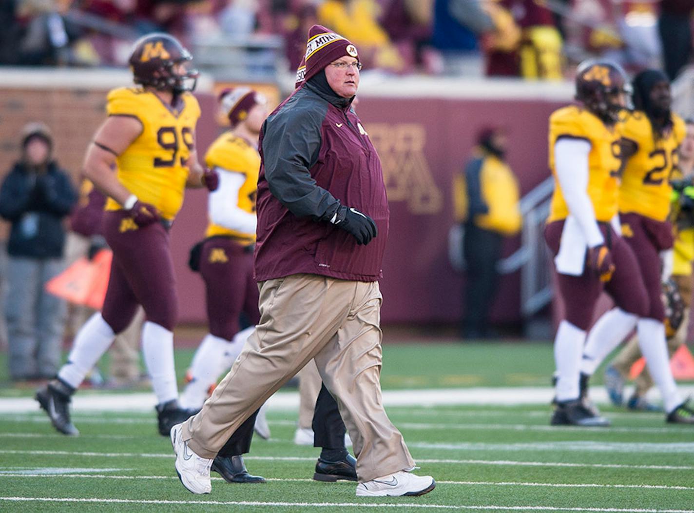 Minnesota Golden Gophers head coach Tracy Claeys ran onto the field after Minnesota's 32-23 victory over the Illinois Fighting Illini Saturday.