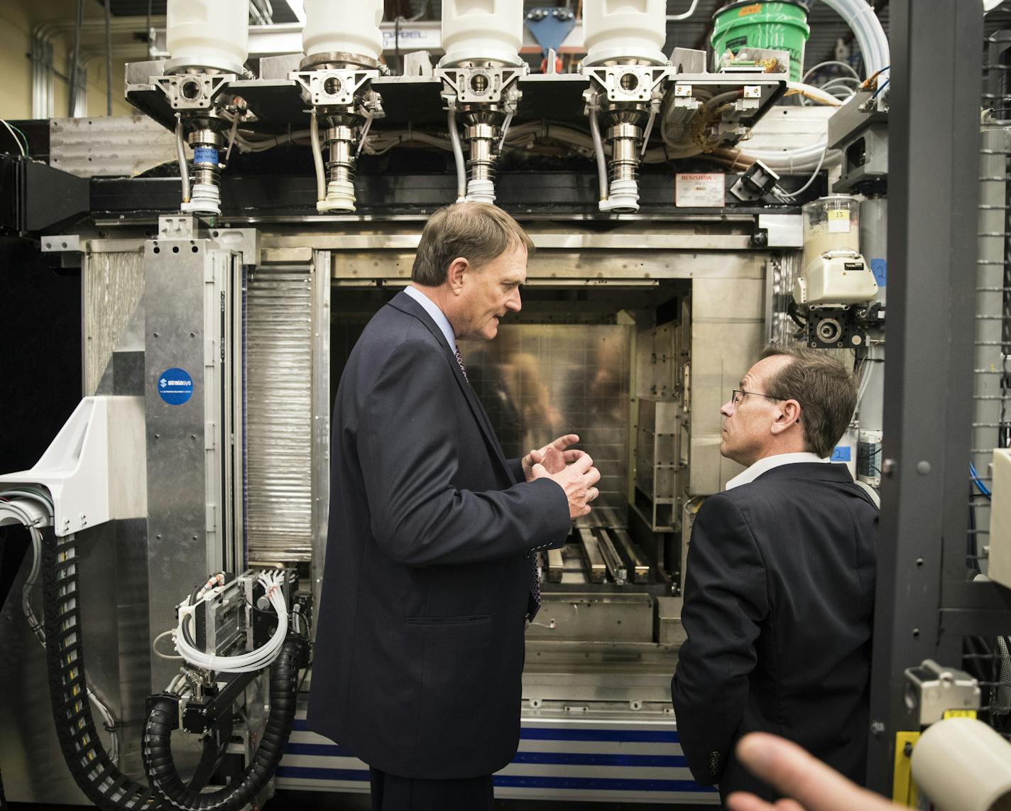 Stratasys founder Scott Crump, left, explained the Infinite Build 3D Demonstrator to Todd Grimm of TA Grimm and Associates during a tour at Stratasys headquarters on August 23, 2016, in Eden Prairie, Minn. ] RENEE JONES SCHNEIDER &#x2022; renee.jones@startribune.com