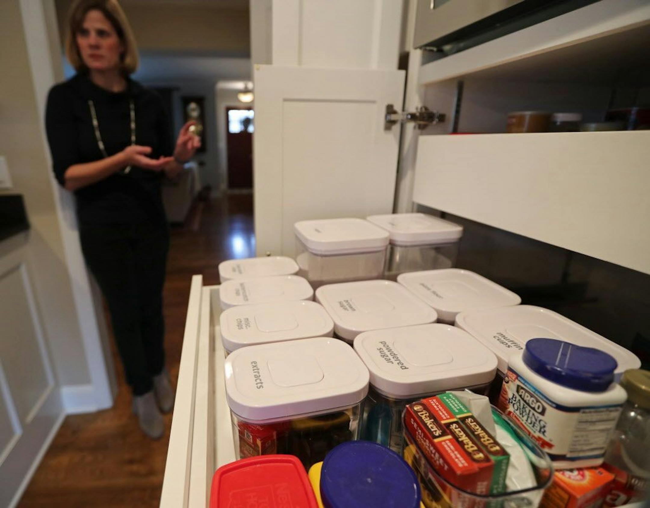 After the reorganization, Kershner's cupboards are neat and tidy, with like things stored together in labeled containers.