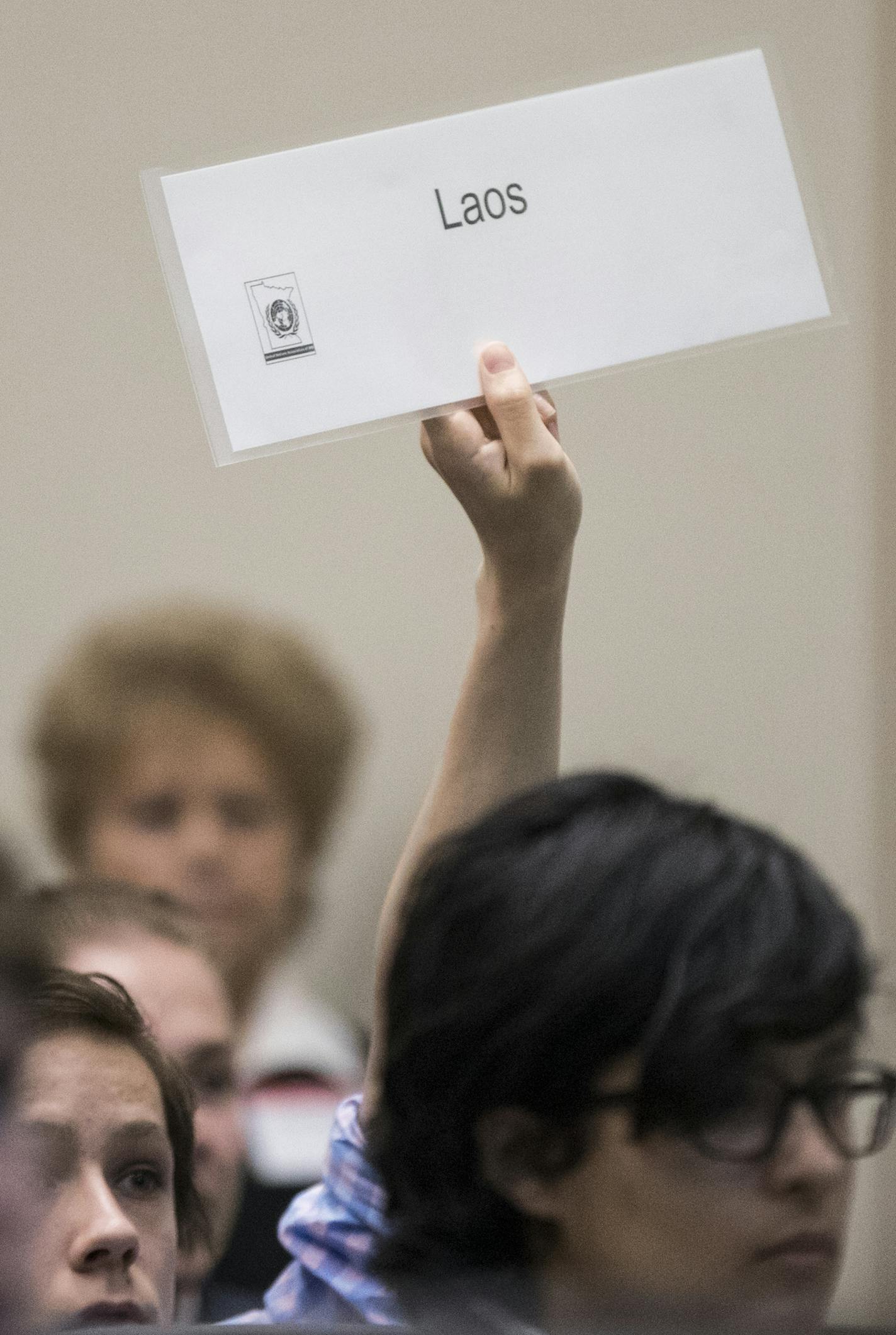 A student held up their country during role call during a Spanish-language model UN, the only one of its kind in the nation, at Cargill in Wayzata, Minn., on Tuesday, April 18, 2017. ] RENEE JONES SCHNEIDER &#x2022; renee.jones@startribune.com