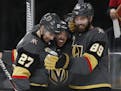 Vegas Golden Knights defenseman Shea Theodore (27), center Jonathan Marchessault, center, and right wing Alex Tuch (89) celebrate Tuch's goal against 