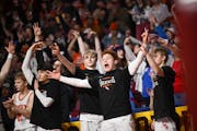 The Cherry bench erupts after a Noah Asuma three-pointer in Friday's 76-58 victory over Nevis in Class 1A semifinals at Williams Arena. Nevis coach Sc