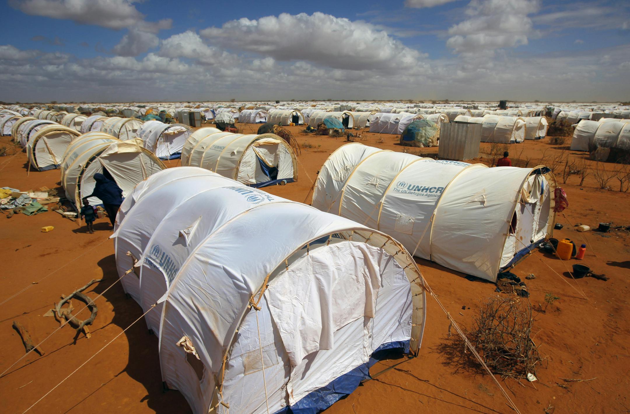 In this photo taken Friday, Aug. 5, 2011 tents are seen at the UNHCR's Ifo Extension camp outside Dadaab, eastern Kenya, 100 kilometers (62 miles) from the Somali border. The Dadaab refugee camp - the largest in the world - was built for 90,000 people. The current population is over 400,000 with thousands of new arrivals crammed into areas outside the refugee camp, waiting to be formally admitted. (AP Photo/Jerome Delay)