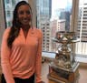 LPGA golfer Cheyenne Woods poses with the trophy awarded to the winner of the Women's PGA Championship. The event is coming to Hazeltine in 2019, and 