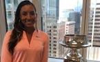 LPGA golfer Cheyenne Woods poses with the trophy awarded to the winner of the Women's PGA Championship. The event is coming to Hazeltine in 2019, and 