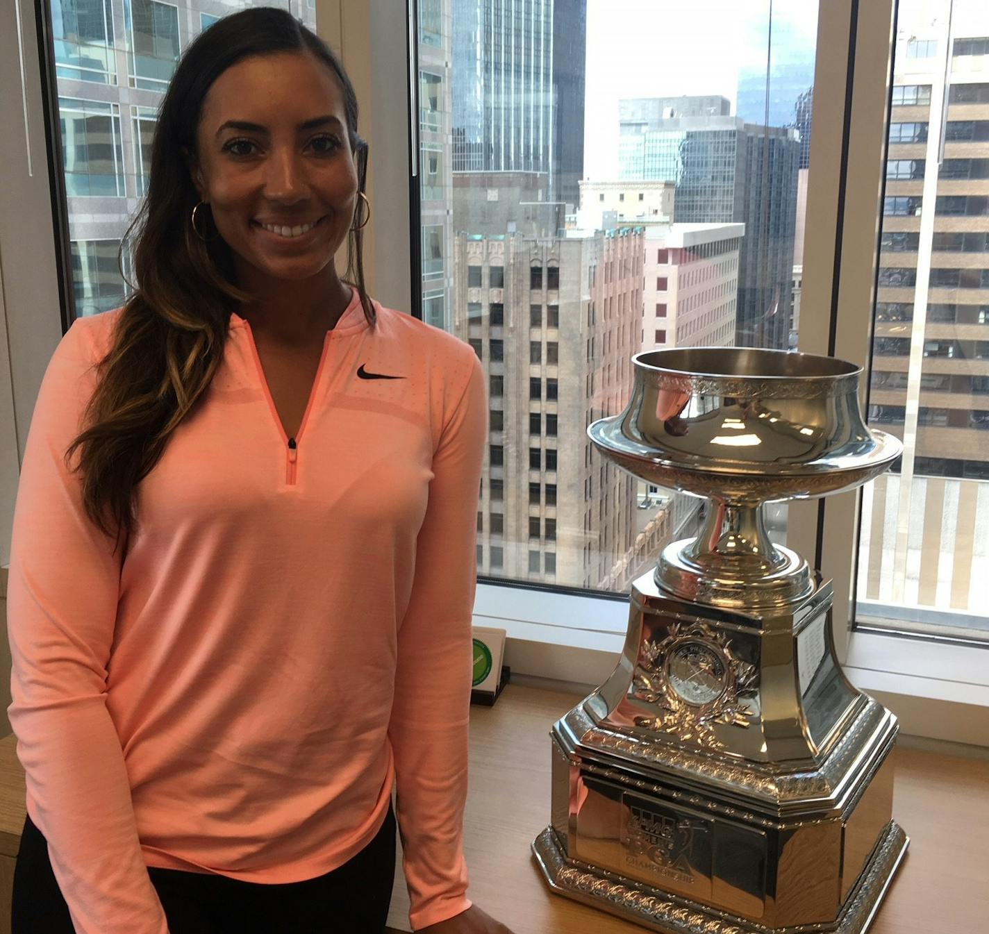 LPGA golfer Cheyenne Woods poses with the trophy awarded to the winner of the Women's PGA Championship. The event is coming to Hazeltine in 2019, and she's hoping to win. Photo/Michael Rand