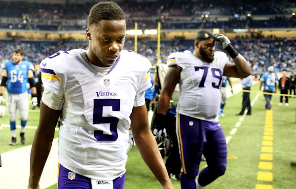 Minnesota Vikings quarterback Teddy Bridgewater (5) walked off the field after his team loss to Detroit 16-14 at Ford Field Sunday December 14, 2014 i