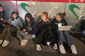 Staff members of the Columbia Daily Spectator, the college newspaper, work into the night as police cleared out demonstrators from Columbia University