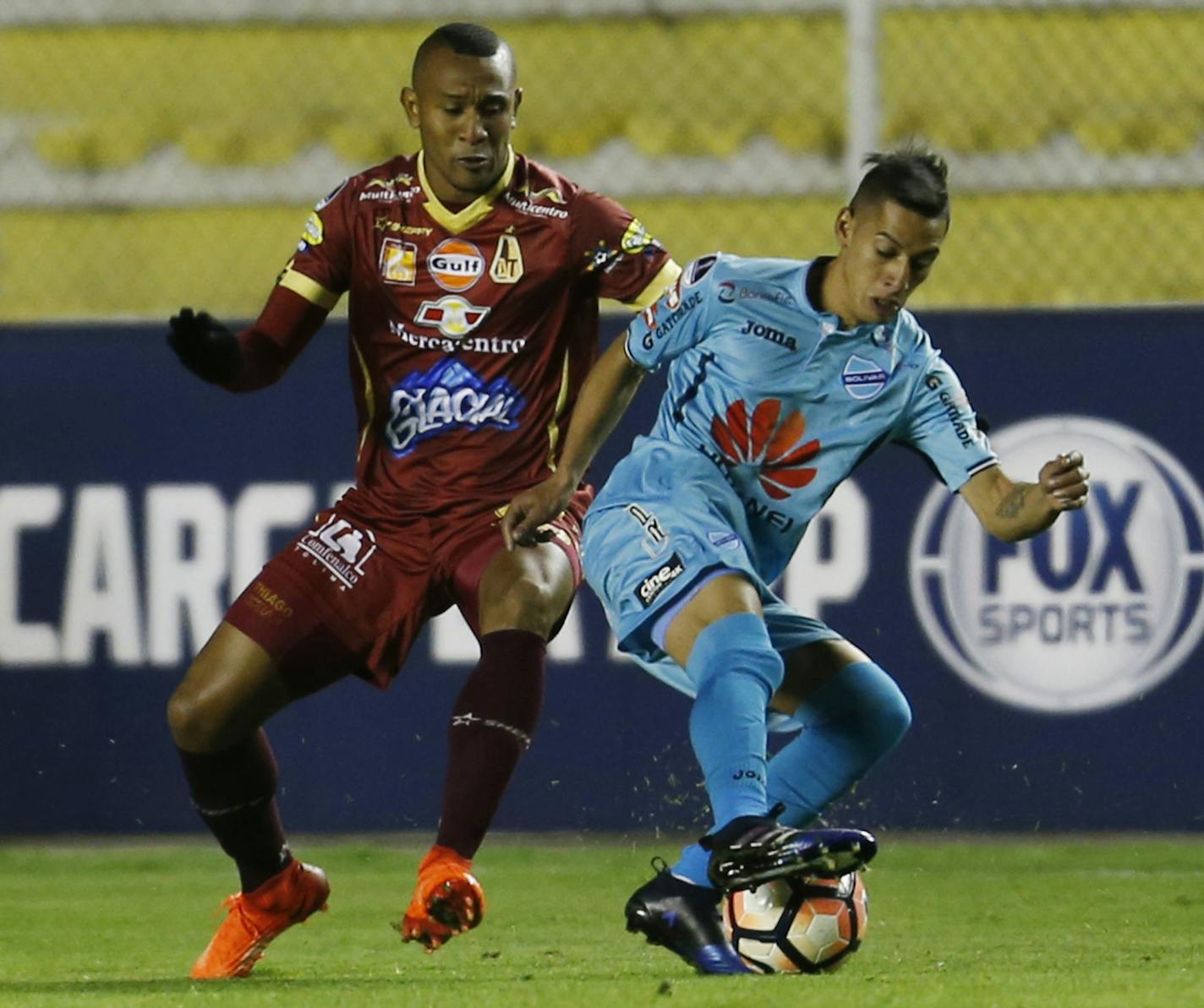 Gaston Cirino, right, of Bolivia's Bolivar, fights for the ball with Angelo Rodriguez of Colombia's Tolima during a Copa Sudamericana soccer match in La Paz, Bolivia, Thursday, June 1, 2017. (AP Photo/Juan Karita) ORG XMIT: XJK103