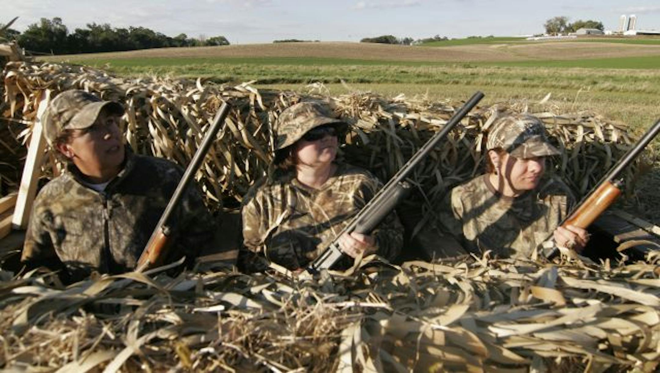 Leslie George of Glenwood, Jamie Gangaware of Spring Lake Park and Ann Geisen of Brainerd hunkered in a blind near Chaska.