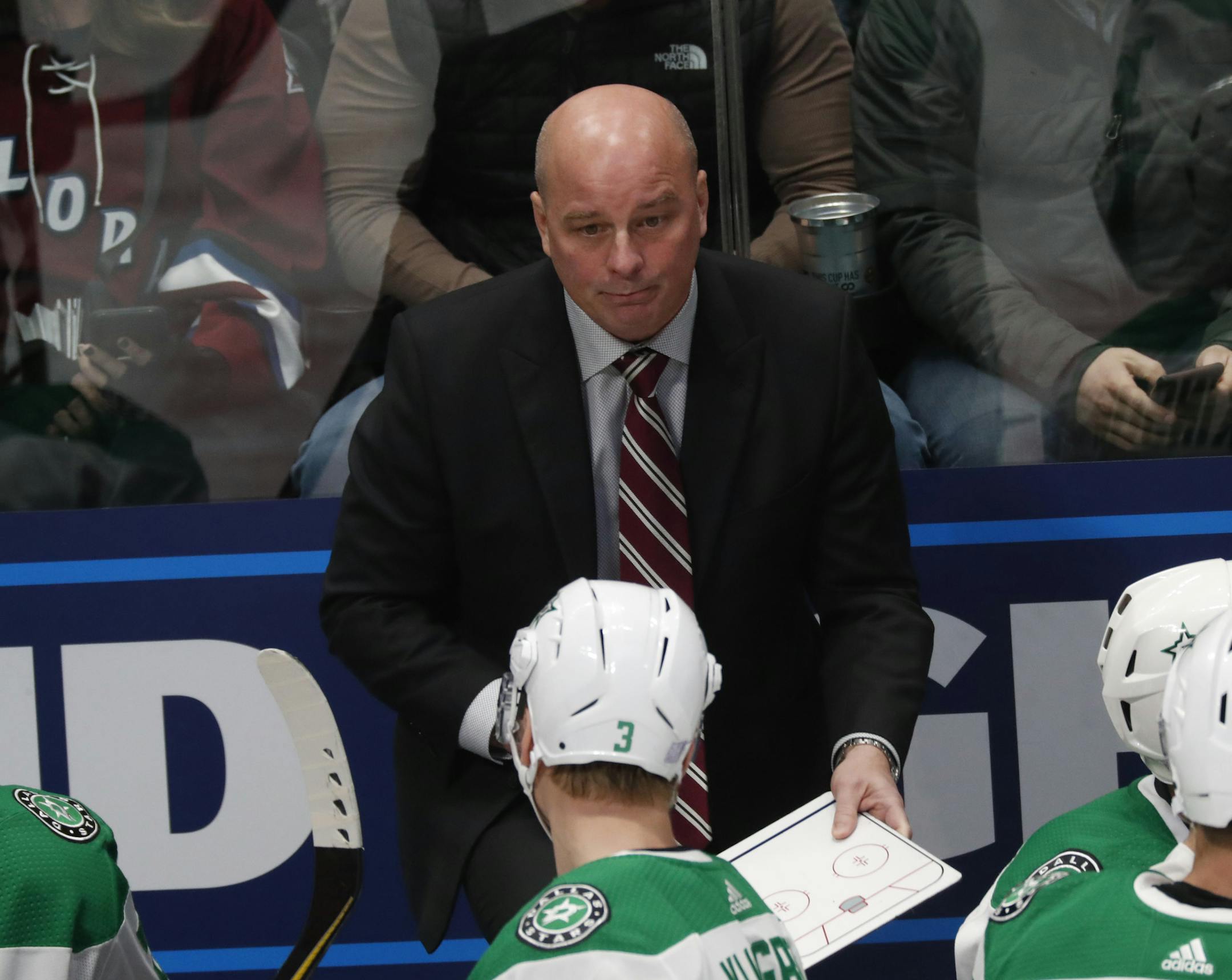 Dallas Stars head coach Jim Montgomery in the first period of an NHL hockey game Friday, Nov. 1, 2019, in Denver. (AP Photo/David Zalubowski)
