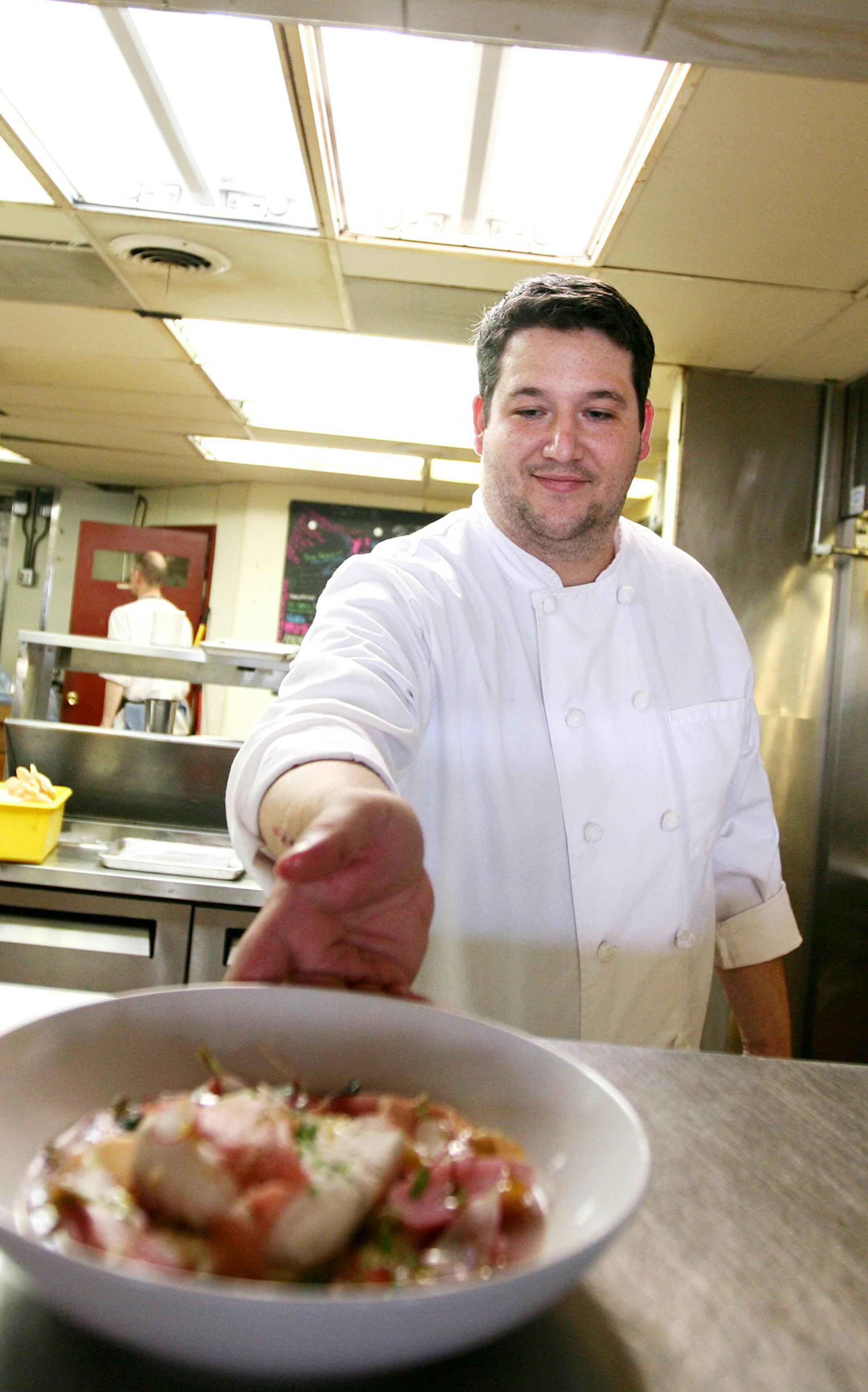 Chef Thomas Boemer prepares a spring dish at Corner Table in Minneapolis June 7, 2013. (Courtney Perry/Special to the Star Tribune)