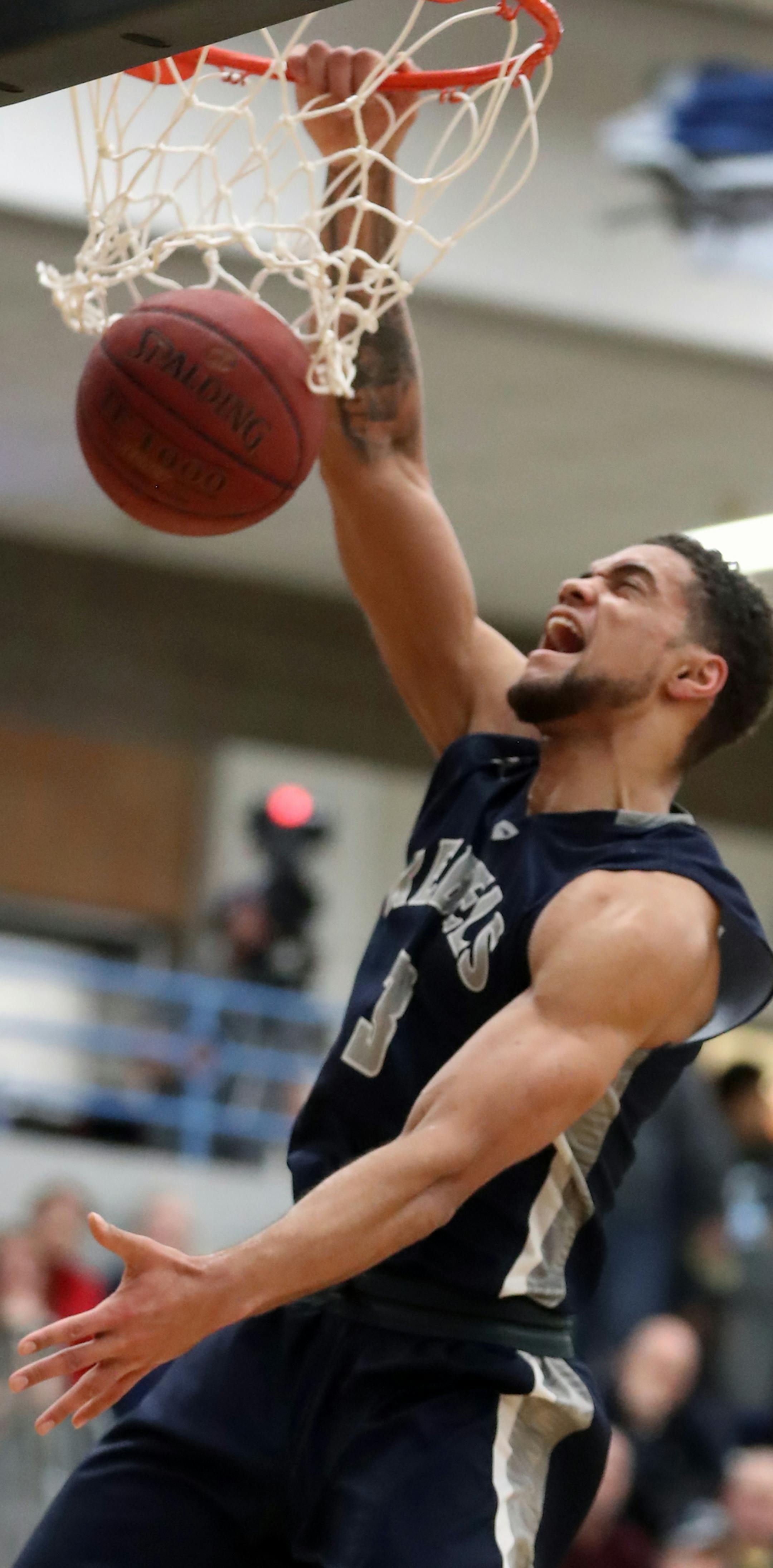 Theo John(3) make one of several crushing dunks. Champlin crushed Anoka in a home game.] RICHARD TSONG-TAATARII • richard.tsong-taatarii@startribune.com