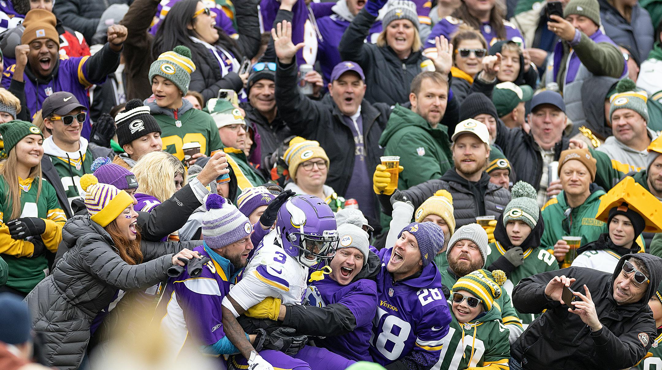 Vikings wide receiver Jordan Addison (3) jumps into the stands for a "Lambeau Leap" in the third quarter at Lambeau Field in Green Bay, Wis., on Sunday, Oct. 29, 2023. ] Elizabeth Flores • liz.flores@startribune.com