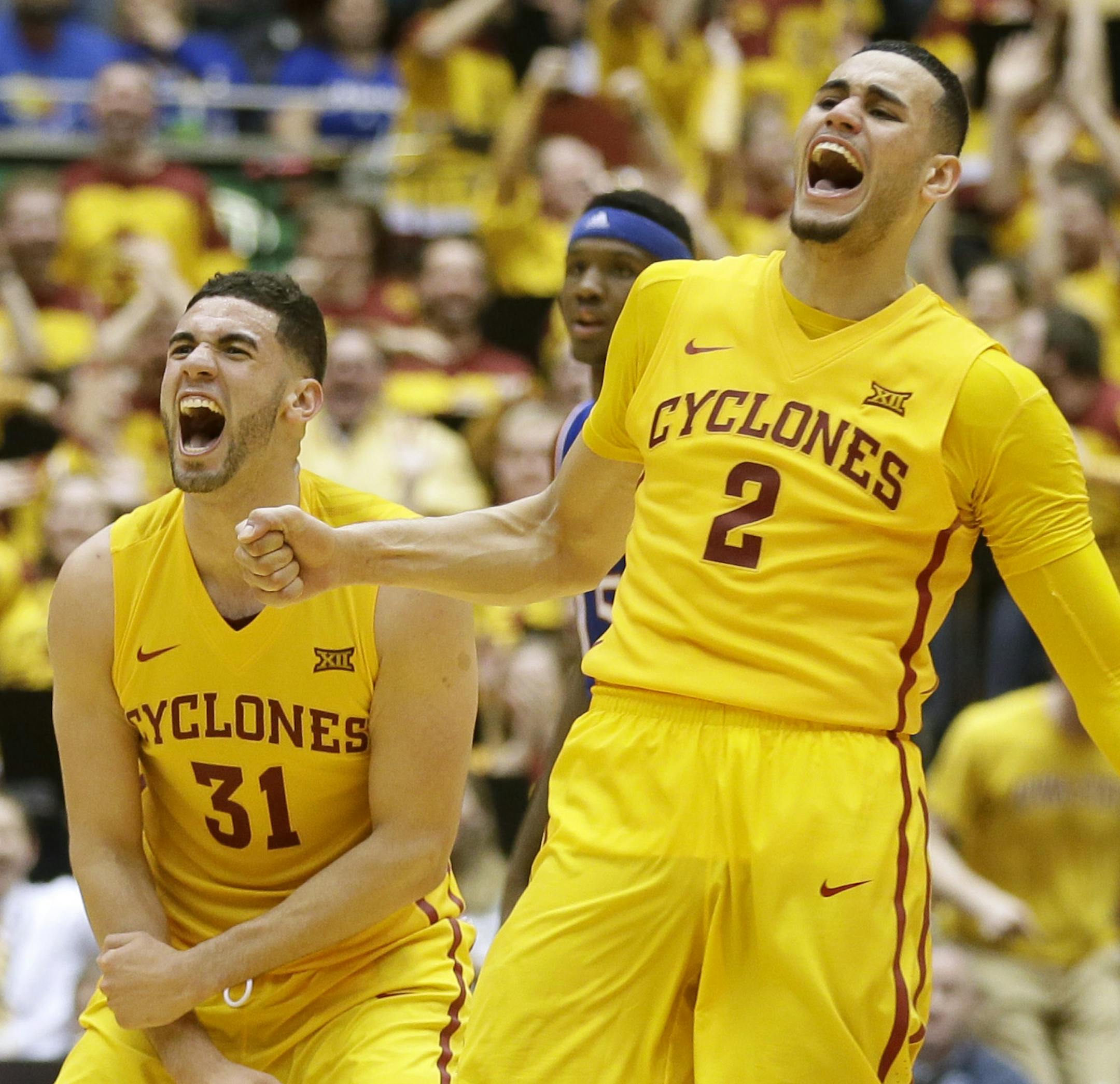 Iowa State forward Georges Niang (31) celebrates with teammate Abdel Nader (2) at the end of an NCAA college basketball game against Kansas, Monday, Jan. 25, 2016, in Ames, Iowa. Iowa State won 85-72. (AP Photo/Charlie Neibergall)