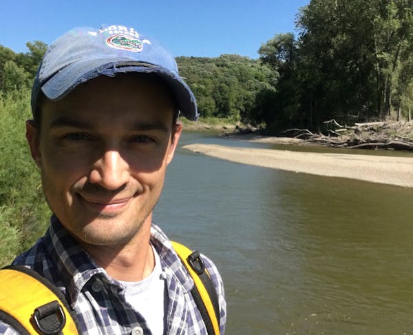 Alex Hastings, curator of paleontology at the Science Museum of Minnesota, during some field work on the Cottonwood River in New Ulm.