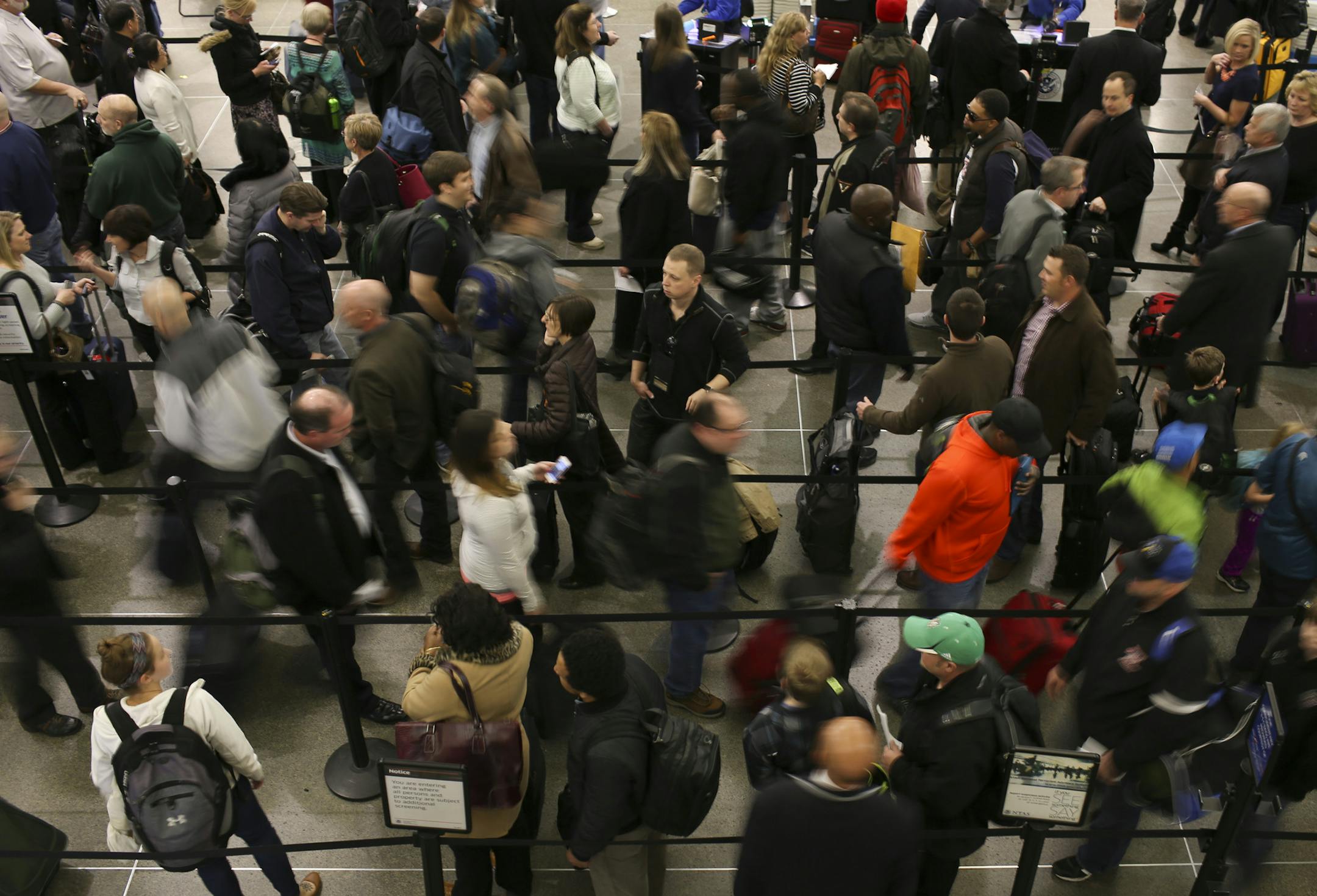 Air travelers waited in line to go through TSA security screening at the airport Wednesday afternoon. ] JEFF WHEELER &#x201a;&#xc4;&#xa2; jeff.wheeler@startribune.com The Metropolitan Airport Commission is telling spring travelers to allow even more time than usual to negotiate parking and security. Lines of travelers waited to go through security in the Lindbergh Terminal at Minneapolis-St. Paul International Airport Wednesday afternoon, March 26, 2014.