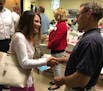 Former U.S. Congresswoman Michele Bachmann shakes hands after speaking at a GOP gubernatorial forum in Waconia on Wednesday.