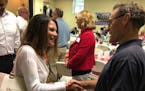 Former U.S. Congresswoman Michele Bachmann shakes hands after speaking at a GOP gubernatorial forum in Waconia on Wednesday.