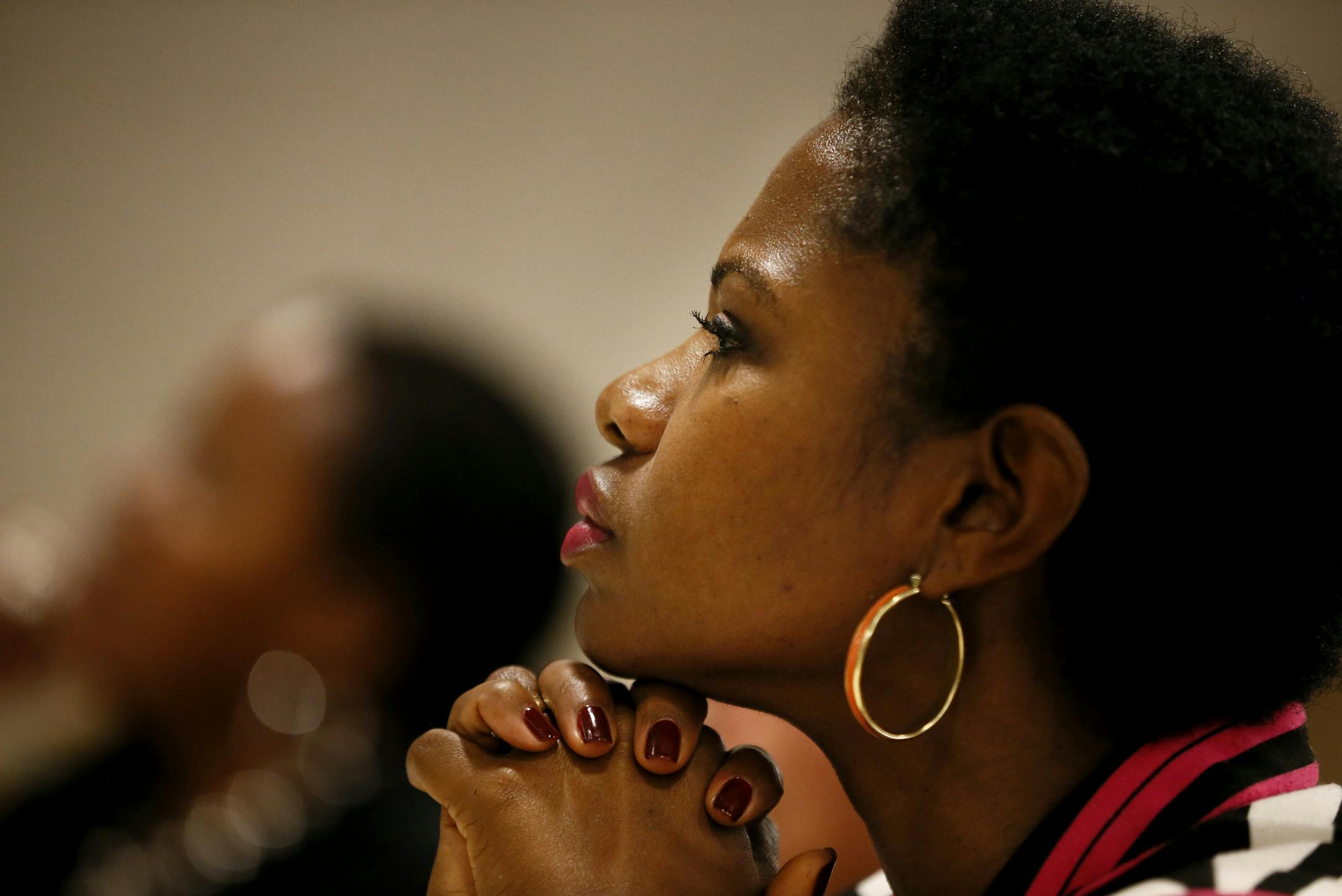 Sondra Samuels President/CEO of Northside Achievement Zone listened as Former Congresswoman Gabrielle Giffords joined Minneapolis Chief Janee Harteau and other local women leaders and domestic violence prevention advocates for a roundtable discussion need for laws the protect women and families form gun violence at the Harriett Tubman Center Monday October 20 , 2014 in Minneapolis ,MN. ] Jerry Holt Jerry.holt@startribune.com