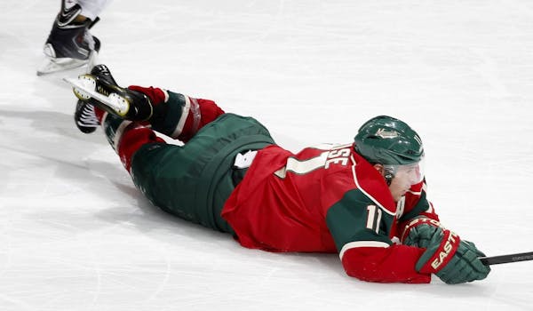 Zach Parise (11) was tripped by Drew Doughty (8) in the third period. Doughty was called for tripping on the play.
